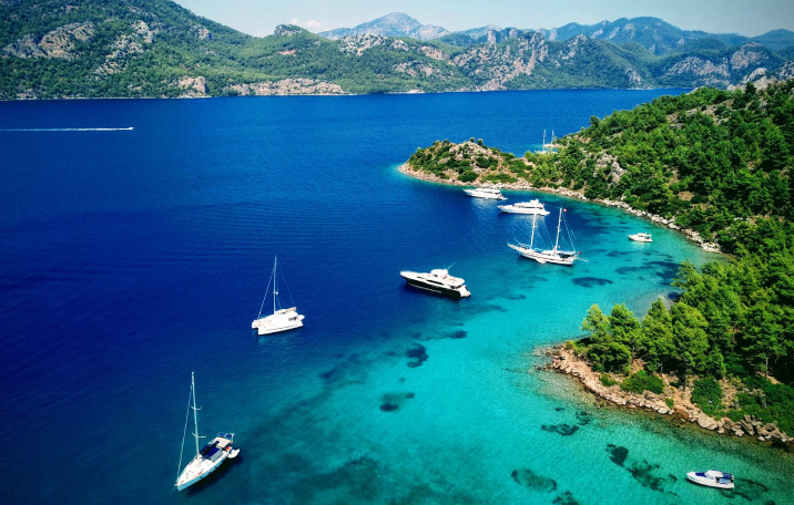 Marmaris harbor at sunset with traditional gulet boats